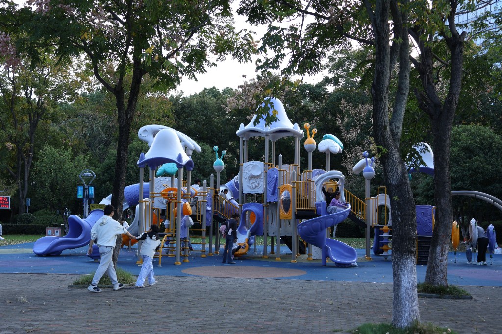 Children and families at a colorful outdoor playground
